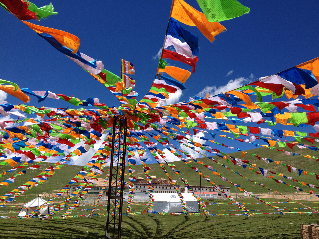 Prayer flags raised to welcome guests to Ayang Gompa, Eastern Tibet