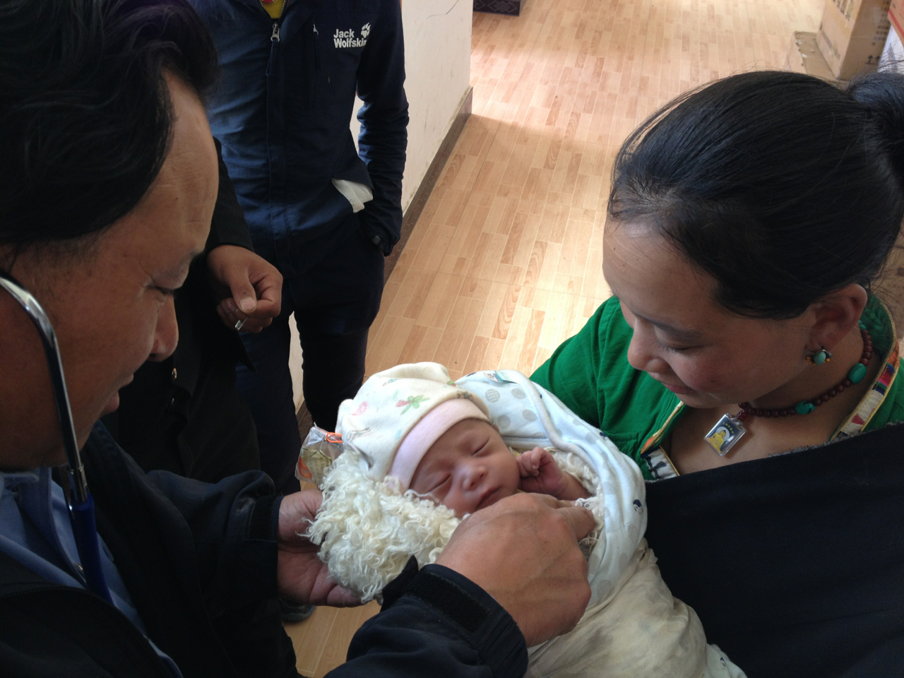 Dr. Ngagay checks newborn
